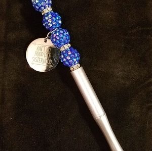 Beaded pen with charms